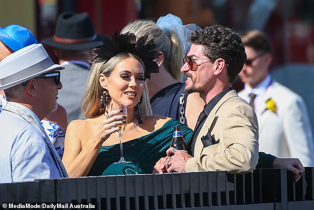 The trio were seen spending hours together drinking at Flemington Racecourse for the Melbourne Cup, as things seemed anything but frosty between them.