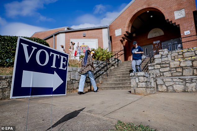 Citizens participate in early voting at a Dekalb County early voting location in Atlanta