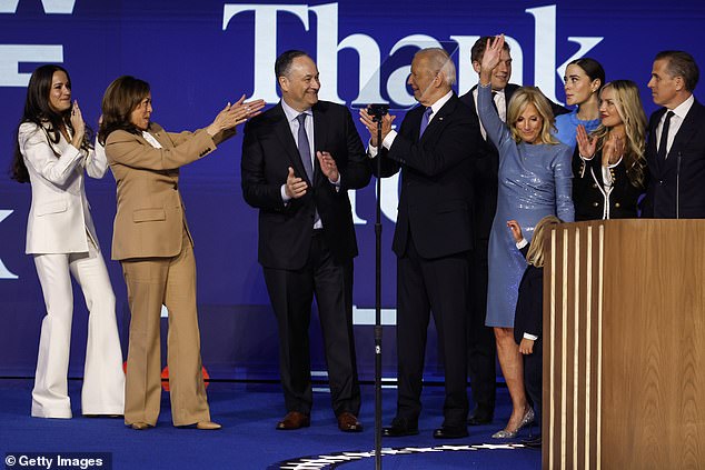 Noami Biden (with the blue dress on the back) hid behind members of her family at the Democratic National Convention in August.