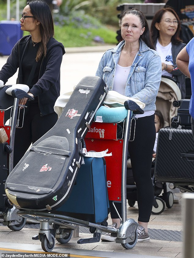 The one-hit wonder, who briefly rose to fame following the success of her song I Wish I Was A Punk Rocker in 2006, kept a low profile as she made her way through the busy arrivals area.