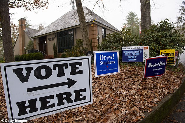 Voting signs direct people to Biltmore Forest City Hall on November 5, 2024 in Asheville, North Carolina.