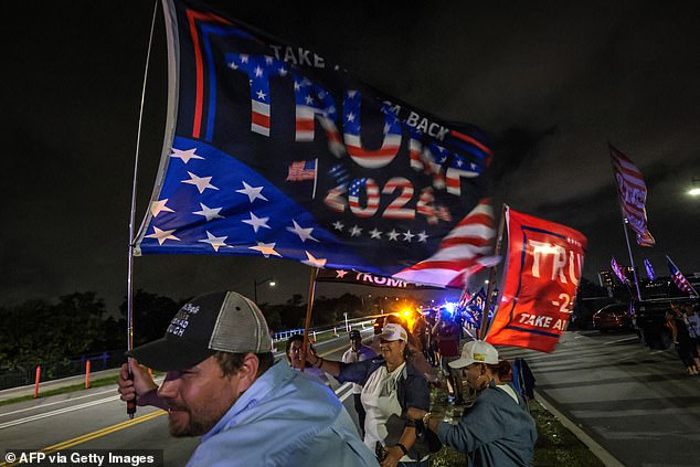 Supporters waved flags and set off fireworks outside Mar-a-Lago.