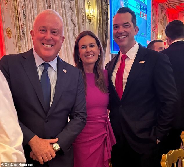 Trump's former press secretary and current Arkansas governor, Sarah Huckabee-Sanders (center), smiled at the party.