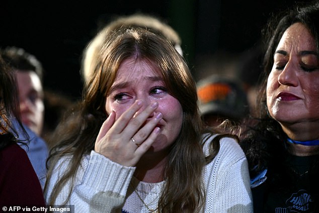 A Harris supporter is seen crying at the election night event at Howard University in Washington DC.