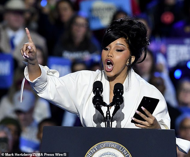 He has faced criticism for having to read his endorsement of the vice president from his phone after the teleprompter failed; photographed at the rally