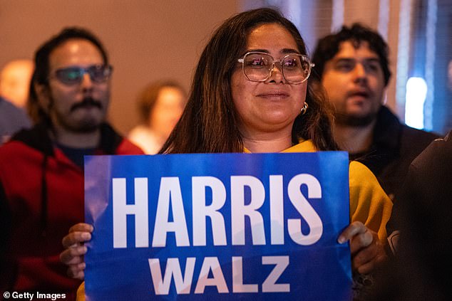 A Kamala Harris supporter cries as she watches the votes roll in for Donald Trump at an election party in San Francisco.