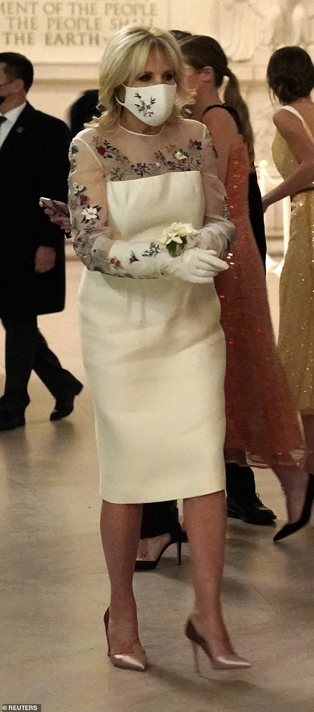 The mother of one wore a custom ivory Gabriela Hearst dress, which contained floral embroidery depicting 