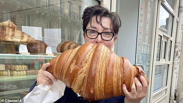 Sue Perkins poses with a giant croissant. 'Sue praised the flavours, but I have my doubts about her reliability as a food critic'