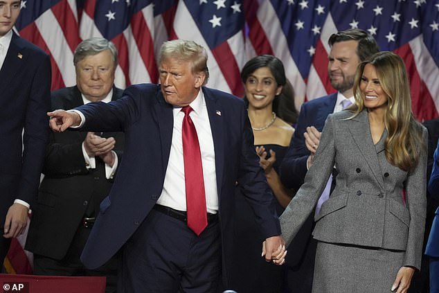 Trump (pictured left with wife Melania) declared victory in front of a large group of Republican supporters early Wednesday morning US time.