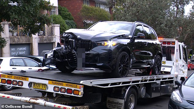 Ritchie's luxury BMW sustained significant damage to the driver's side. The bonnet was visibly warped following the accident, and damage was also caused to the wheels, bumper and radiator grille. The car's engine also appeared visible as it was being towed for repair.