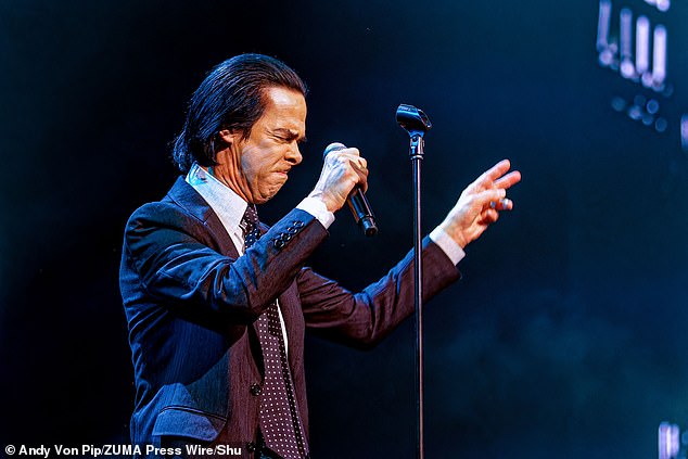 The rock musician, 67, looked like he was giving it his all as he took to the stage in his signature dapper suit to perform a mix of new and original material.