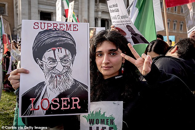 People supporting the Iranian community participate in the Freedom Rally for Iran demonstration against the Iranian regime on February 22, 2023 in Rome, Italy.