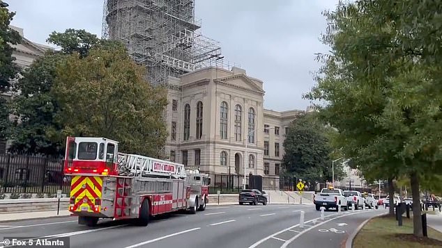 Atlanta Gas Light, which is on scene, said a six-inch gas line was damaged. Roads in the area are closed to traffic and are expected to reopen around 1 p.m.