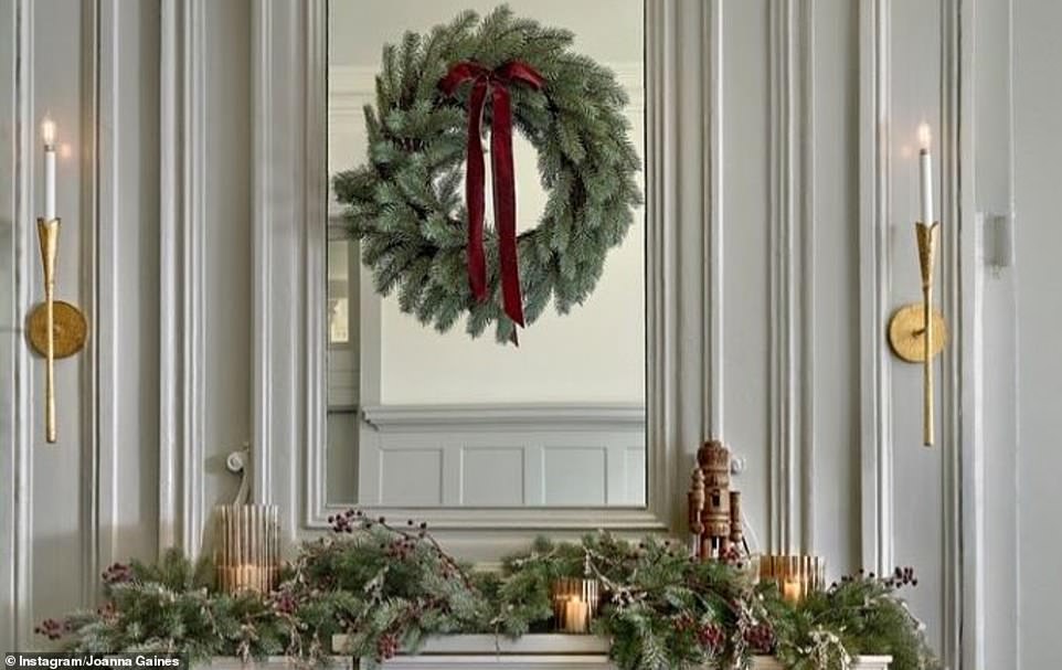 Her mantle had branches, berries, candles and a wooden nutcracker.