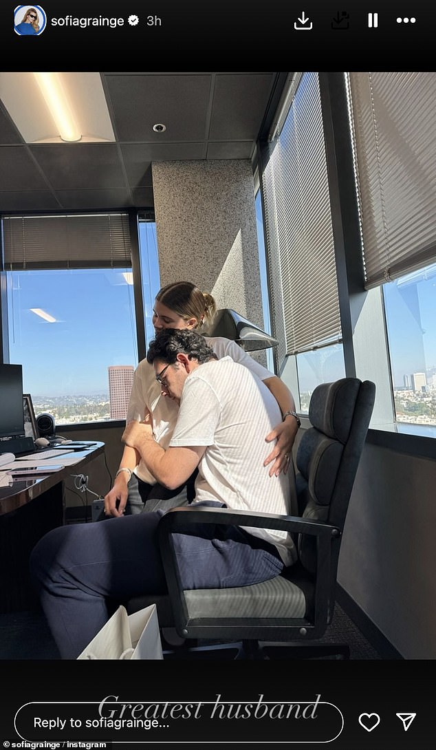 She also shared a photo of her and Grainge enjoying a romantic moment during their free time in an office, calling it the 