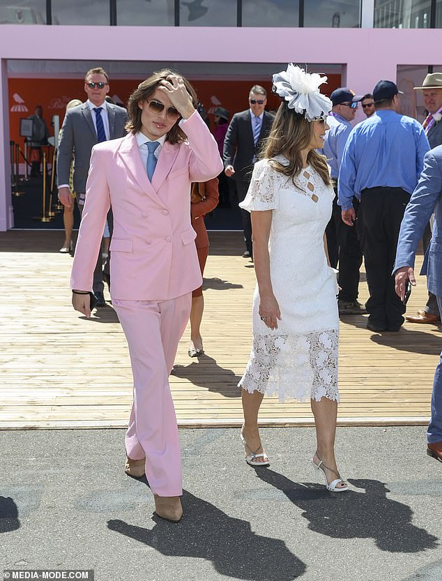 After Liz made a bold statement dressed in yellow earlier in the week, the mother-son duo perfectly encapsulated the pastel and white themed dress code.