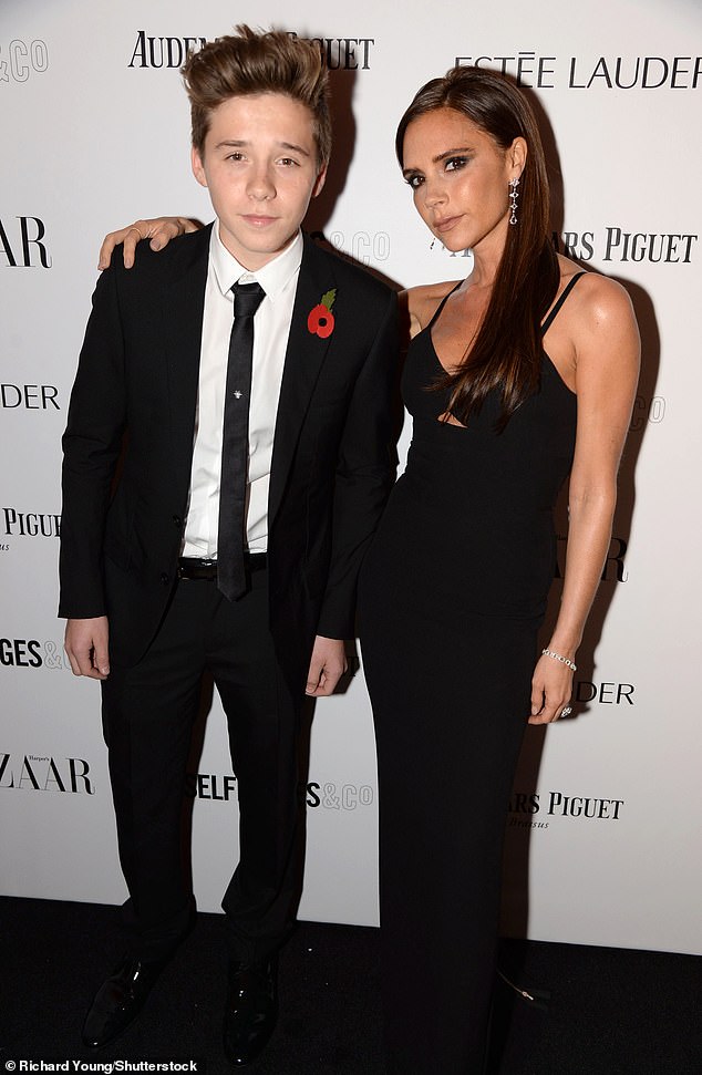 Harper's appearance mirrors that of her older brother Brooklyn in 2013. She is pictured with Victoria at the Harper's Bazaar event in November of that year.