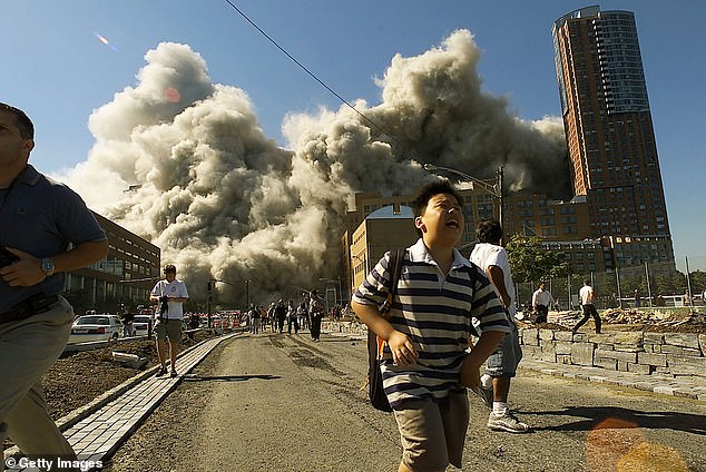 People flee when the North Tower of the World Trade Center collapses on September 11, 2001.