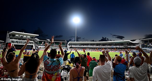 West Indies fans applaud from the 'party stand' during the third ODI at Bridgetown