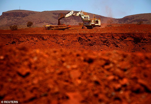 US tariffs on Chinese goods could lead to lower demand for Australian exports such as iron ore. Pictured is an iron ore mine in Port Hedland, WA.