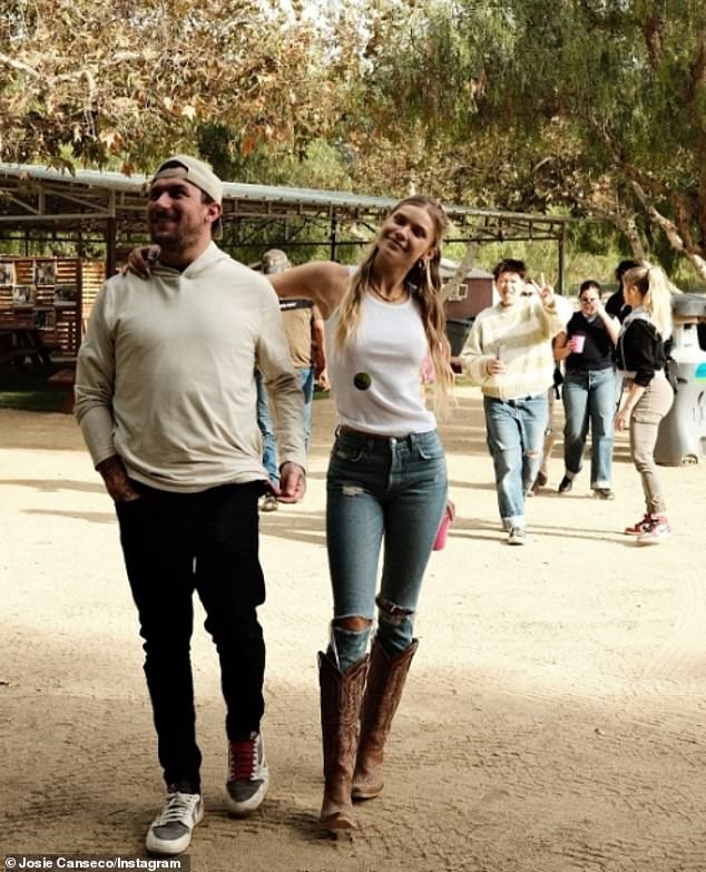 Josie stayed comfortable for the outing in a white T-shirt, blue jeans, and cowboy boots.