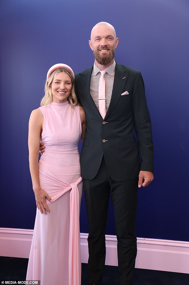 AFL Wag Jessica Gawn, pictured here with her husband Max, opted for a low-key look on Oaks Day but didn't pull it off.