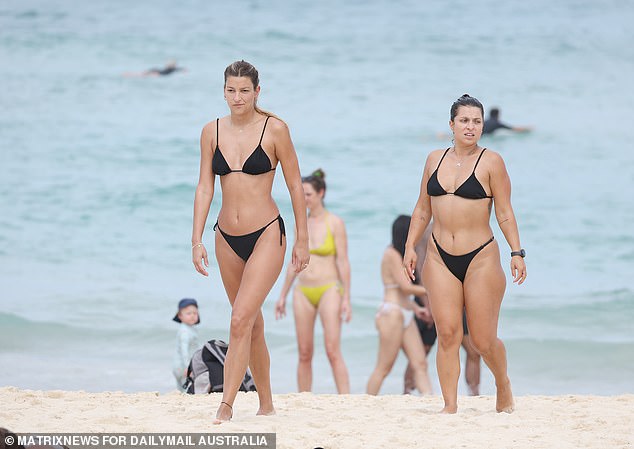 But until there is a respite, much of Australia will continue to burn under extreme heatwave conditions caused by a large mass of hot air (pictured, beachgoers at Bondi Beach).