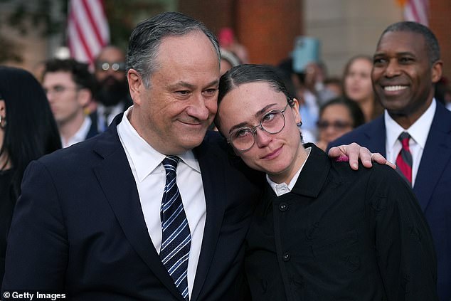 Her father, Doug Emhoff, was later seen hugging his daughter closely.