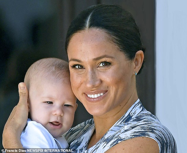 The Duchess of Sussex holding her four-month-old son Archie in September 2019 in Cape Town.