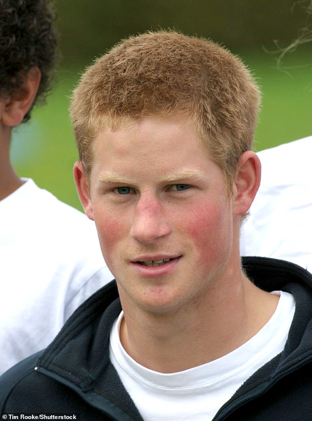 The Prince, with short hair, pictured working as a development assistant with the Rugby Football Union at a primary school in 2004.