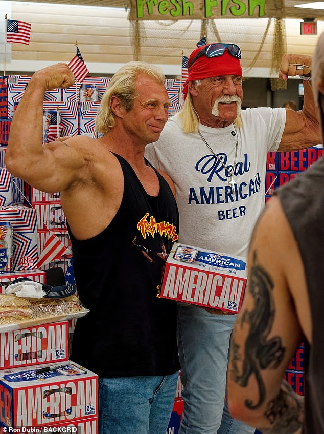 In the crowded supermarket, the former wrestler showed off his muscles as he posed with his fans and his brand of beer while celebrating Trump's election victory.