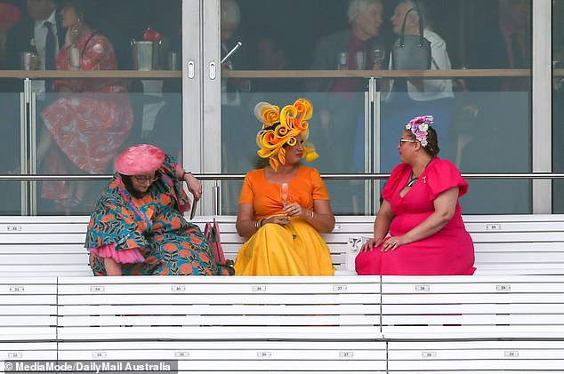 Many revelers ran for shelter after the rain began, leaving only the most dedicated fans to brave the weather.