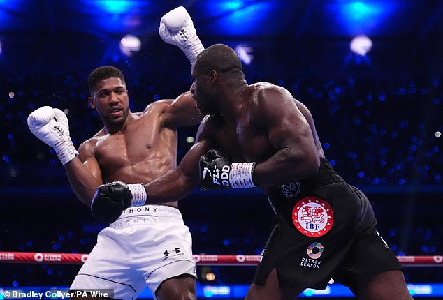 Joshua (left) was stopped in the fifth round of his clash against Daniel Dubois (right) in September.