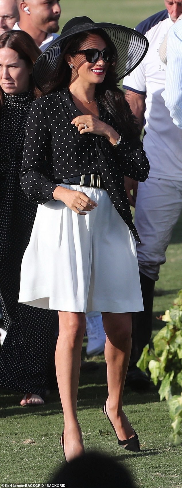 Meghan Markle wore an elegant Celine polka dot blouse with a tie neck, which she paired with voluminous Khaite shorts and Aquazzura heels.