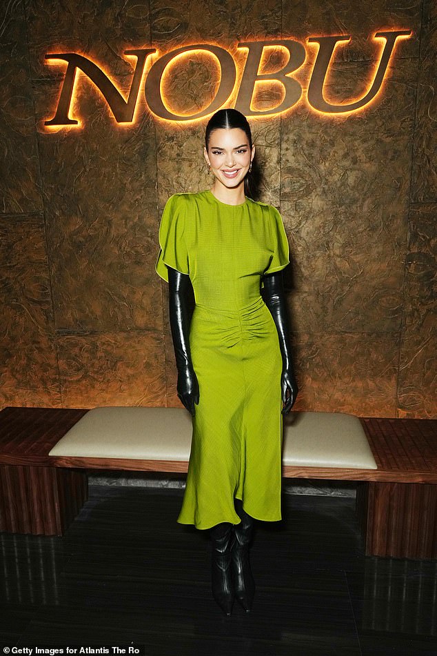 Kendall Jenner with the parrot green midi dress from Victoria Beckham's eponymous brand