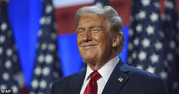 Former President Donald Trump, Republican presidential candidate, smiles at an election night watch party at the Palm Beach Convention Center, Wednesday, Nov. 6, 2024, in West Palm Beach, Fla. (AP Photo/Evan Vucci)