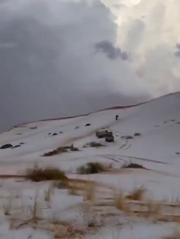 Images and videos show drops of ice, which almost look like snow, covering large areas of the sandy desert.