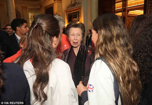 The princess royal looked elegant in a burgundy coat dress, as she stood in for Camilla.