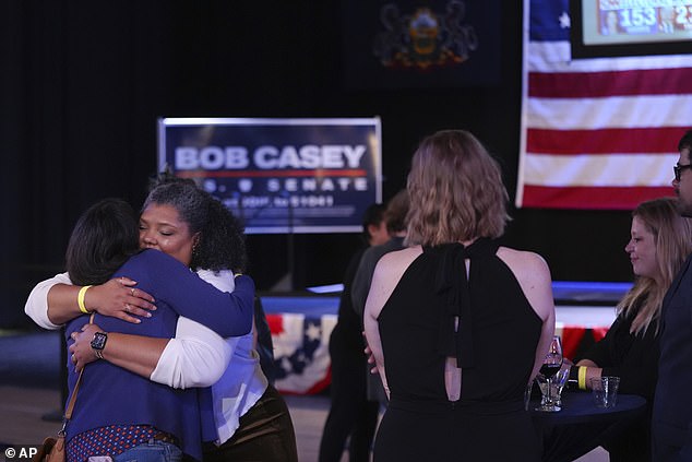 Casey supporters hug as they leave his election night watch party in Scranton, PA, before the race is called.