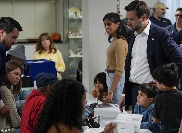 Usha and JD Vance at a polling place before casting their votes in the 2024 election on November 5 with their three children.