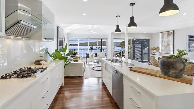 Located on Pretty Beach, it also features a second floor entertainment deck and a beautiful modern kitchen. (Pictured)