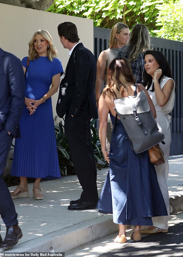 Angie Asimus (left) wore a royal blue dress with a pleated skirt, while Spotlight's new executive producer Gemma Williams (centre back) was seen chatting with other guests.