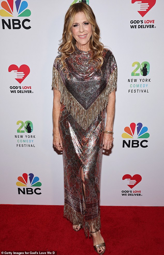 Tom Cruise's wife, Rita Wilson, brought a touch of Malibu elegance to the event in a sparkling chrome and silver dress full of fringe.