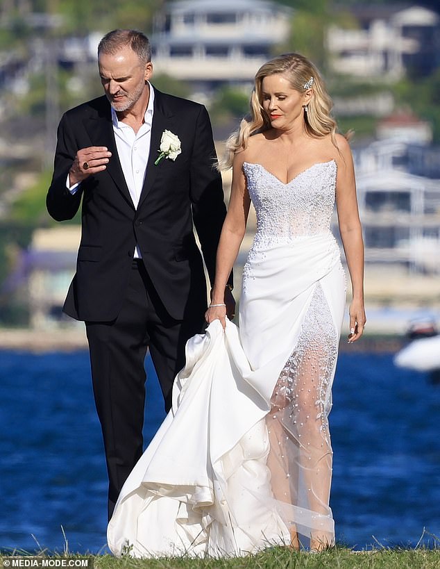 The TV presenter, 51, looked stunning for her big day in a pearl-encrusted strapless white dress by designer Steven Khalil.