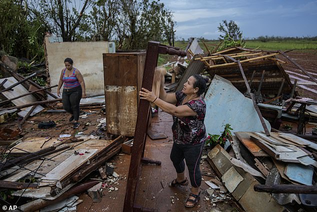 Torrential rains hit Cuba and winds reached up to 105 mph, knocking out power grids across the country.