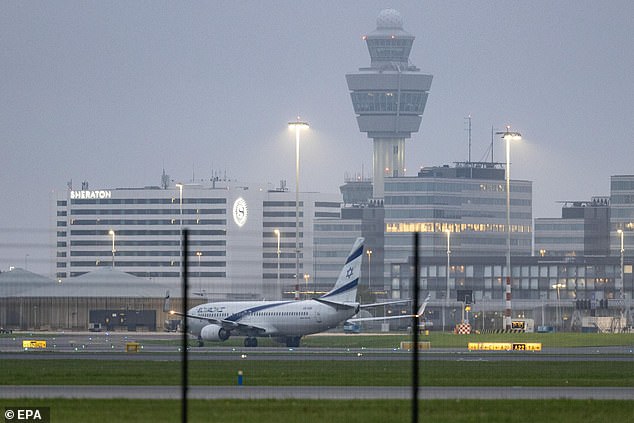 An El Al plane lands on the tarmac at Schiphol airport, near Amsterdam, as the Israeli government prepares to evacuate citizens following attacks on soccer fans.