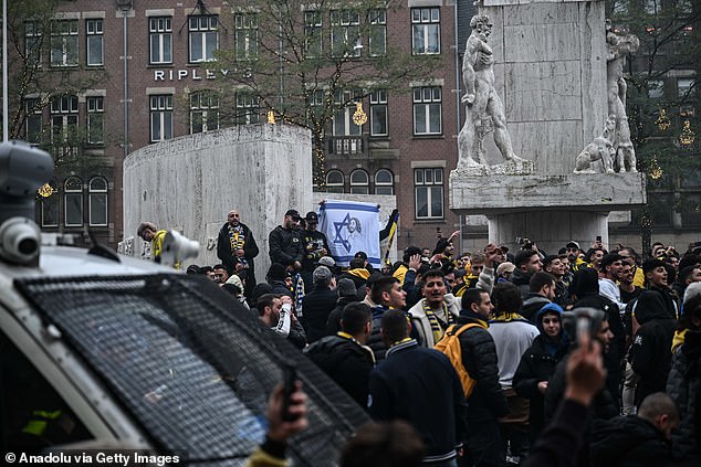 Maccabi Tel Aviv fans stage a pro-Israel demonstration at Dam Square, lighting flares and chanting slogans before the UEFA Europa League match.