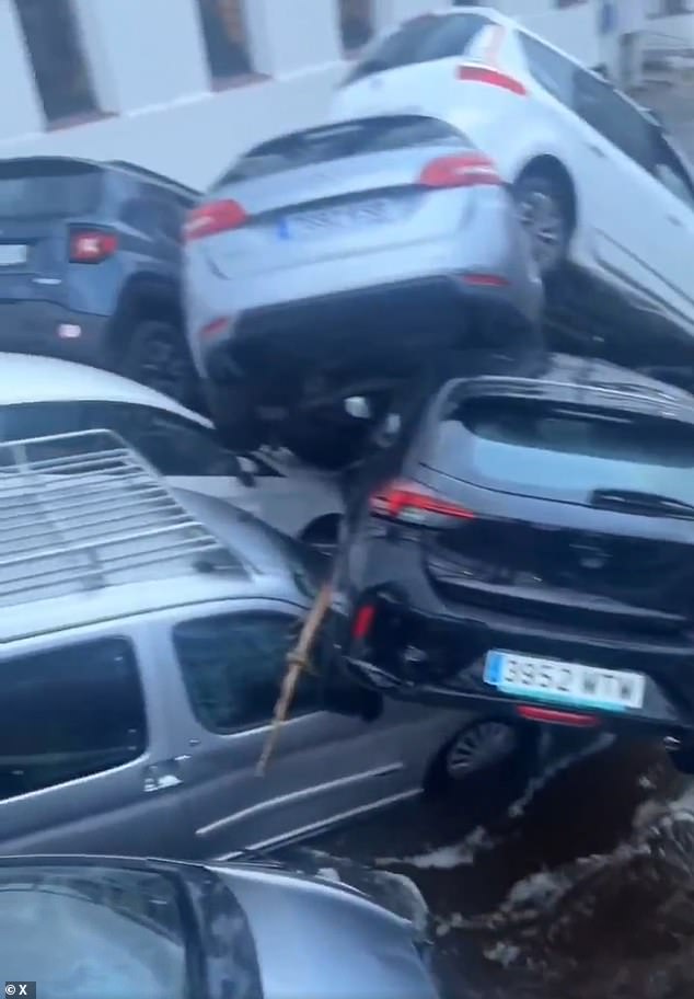 In another video you can see several cars piled up on a bridge in another Spanish town, the last one devastated by floods.