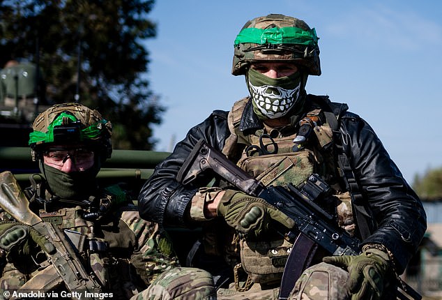 Ukrainian soldiers from the Liut Brigade sit in a van on their way back to the frontline town near Chasiv Yar in the Donetsk region, Ukraine, on October 7, 2024.