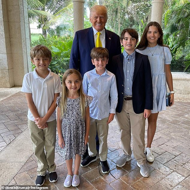 Donald Trump photographed posing for a photo with his son Don Jr's five children on Easter 2021